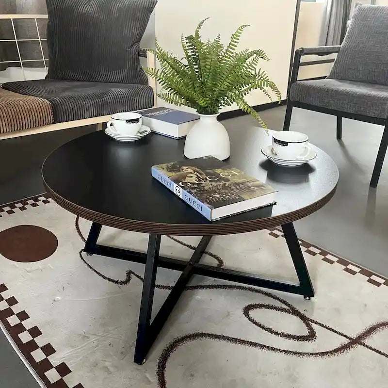 Table basse ronde noire et marron, piétement en X, 2 places