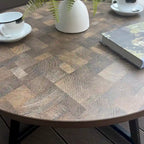 Table basse ronde noire et marron, piétement en X, 2 places