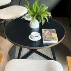 Table basse ronde noire et marron, piétement en X, 2 places
