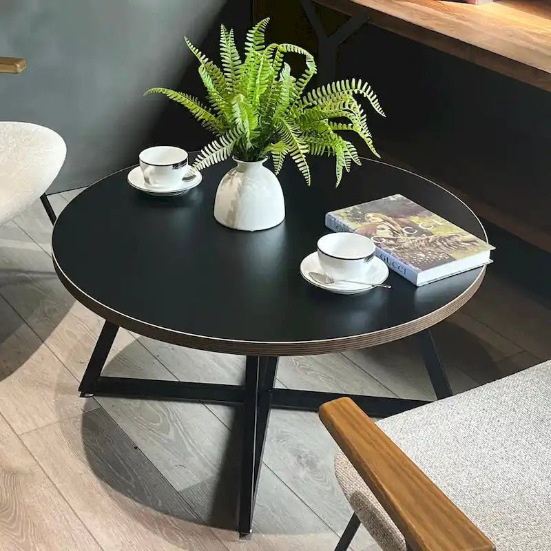 Table basse ronde noire et marron, piétement en X, 2 places