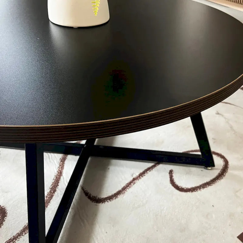 Table basse ronde noire et marron, piétement en X, 2 places