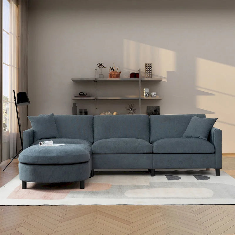 Canapé d'angle 4 places gris foncé avec pouf mobile et accoudoir de rangement