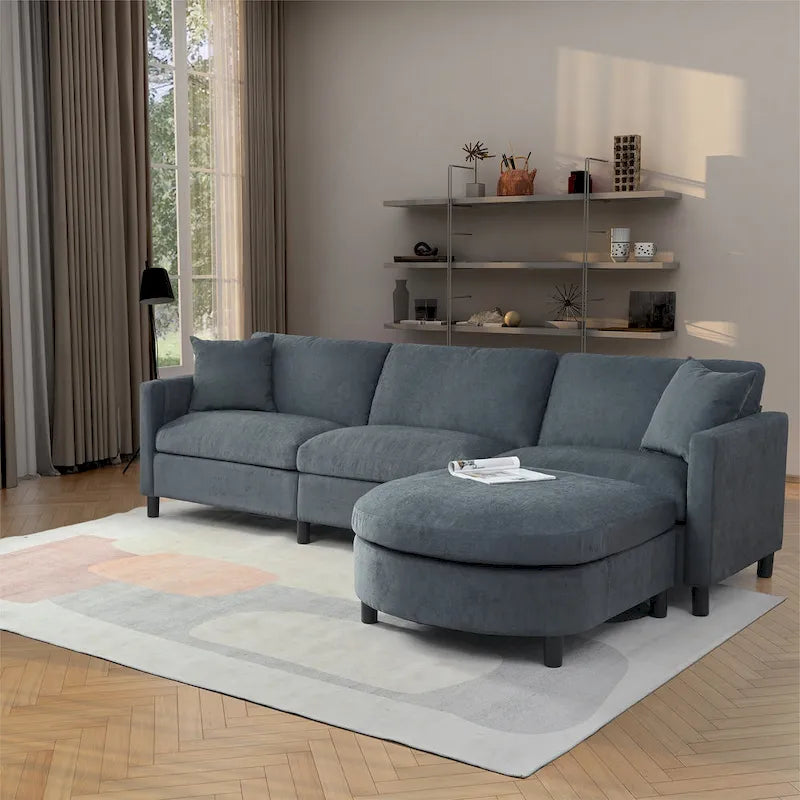 Canapé d'angle 4 places gris foncé avec pouf mobile et accoudoir de rangement