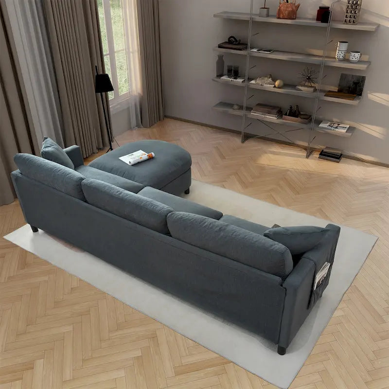 Canapé d'angle 4 places gris foncé avec pouf mobile et accoudoir de rangement