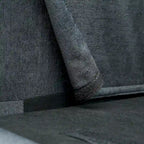Canapé d'angle 4 places gris foncé avec pouf mobile et accoudoir de rangement
